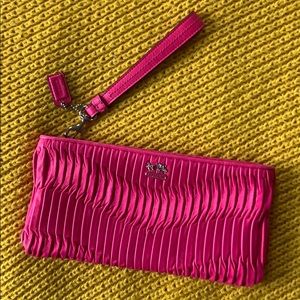 Hot pink Coach wristlet